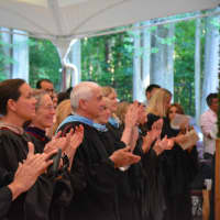 <p>North Salem school officials give a round of applause at the 2016 high school commencement.</p>