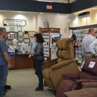 <p>Guests tour the current location of Collins Medical Equipment during the 85th anniversary celebration.</p>