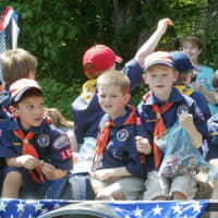 <p>Scouts ride on a float at Sunday&#x27;s parade.</p>