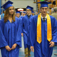 <p>Students enter the Abbott Tech High School graduation.</p>