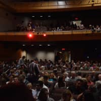 <p>Concertgoers settle into their seats for the first student performance at the new auditorium at Greenwich High School Wednesday.</p>