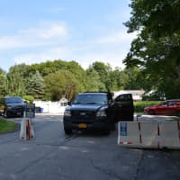 <p>The end of Old House Lane in Chappaqua, which has been closed off by the Secret Service due to security reasons. Hillary Clinton, who lives on the road, is the Democratic presidential candidate. Both of the Clintons&#x27; properties are in the background.</p>