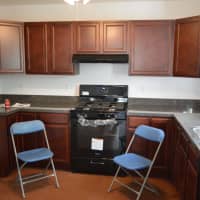 <p>Volunteers put together the kitchen for the Franco family.</p>