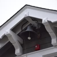 <p>An old bell, a reminder of the Goldens Bridge Community House&#x27;s past as a schoolhouse, hangs above the building&#x27;s entrance. Katonah Art Center owner Loren Anderson plans to use the bell during summer camp.</p>