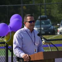 <p>Athletic Director Christian McCarthy speaks at the dedication of the John Jay tennis courts.</p>