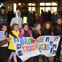 <p>A local Brownie troop of Girl Scouts marches in the &quot;Frosty Day&quot; parade in Armonk.</p>