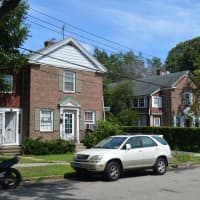 <p>At least two shooters are believed to have shot 13 people partying in the backyard of 19-21 Plymouth Street, left, from the hedges in the backyard at 31-33 Plymouth Street, right.</p>