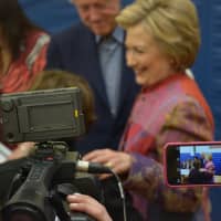 <p>An array of cameras surround Hillary Clinton as she makes a stop at her polling place in Chappaqua to vote in the Democratic presidential primary.</p>