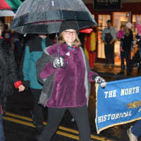 <p>Members of the North Castle Historical Society march in the &quot;Frosty Day&quot; parade in downtown Armonk.</p>