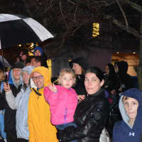 <p>Scores of onlookers line Main Street in downtown Armonk for the &quot;Frosty Day&quot; parade.</p>
