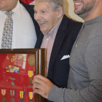 <p>John Gaes, a 92-year-old Stamford resident, receives his long overdue medals from his service in the U.S. Marine Corps during World War II. </p>