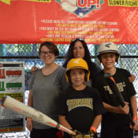 <p>Hitting the batting cage — all for a good cause.</p>