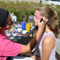 <p>Facepainting is part of the fun at the annual Scarecrow Festival at Oronoque Farms in Shelton.</p>