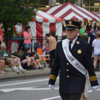 <p>A division marshal marches in the Mahopac Volunteer Fire Department&#x27;s dress parade.</p>
