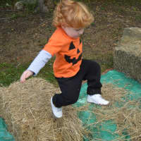 <p>Taking a leap at the annual Scarecrow Festival at Oronoque Farms in Shelton last weekend.</p>