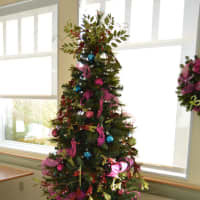 <p>This colorful tree was seen in the room of trees.</p>