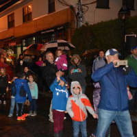 <p>Onlookers in downtown Armonk stand as Frosty the Snowman marches through the hamlet as part of &quot;Frosty Day.&quot;</p>