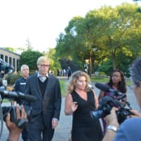 <p>Christopher Schraufnagel and his attorney, Stacey Richman, are surrounded by a media scrum as they leave New Castle Justice Court in downtown Chappaqua.</p>