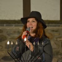 <p>Cantor Shira Adler sings on the first night of Hanukkah in Katonah.</p>