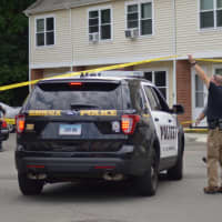 <p>A Norwalk police cruiser arrives at the scene of a stabbing at a housing complex in Norwalk Wednesday morning.</p>