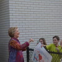 <p>Hillary Clinton meets a crowd of supporters after casting her Democratic presidential primary ballot in Chappaqua. Bill Clinton is pictured at left.</p>