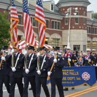 <p>Mahopac Falls firefighters march in the Mahopac Volunteer Fire Department&#x27;s dress parade.</p>