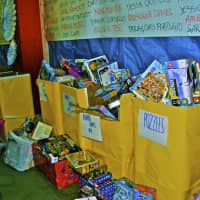 <p>Toys are sorted by kind as they await wrapping at last year&#x27;s Holiday Gift Collection event, sponsored by Inspirica and Eversource in Stamford.</p>