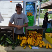 <p>Nick Harper from Southbury&#x27;s Daffodil Hill Growers sells fresh vegetables at the Newtown Farmers Market.</p>