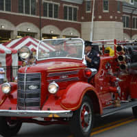 <p>An antique Mahopac Falls firetruck is driven at the Mahopac Volunteer Fire Department&#x27;s dress parade.</p>