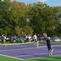 <p>Action on the John Jay tennis courts following a dedication ceremony.</p>