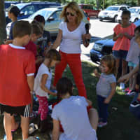 <p>Kids circle around for a prize after the pumpkin race.</p>