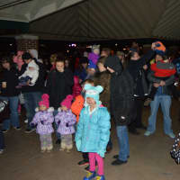 <p>Kids, friends and families celebrate the third annual tree lighting at Shelton&#x27;s Veterans Memorial Park over the weekend.</p>