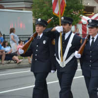 <p>Carmel firefighters march in the Mahopac Volunteer Fire Department&#x27;s dress parade.</p>