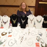 <p>Another vendor shows off an array of jewelry choices — always a favorite gift for the holidays.</p>