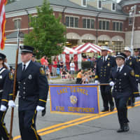 <p>Lake Carmel firefighters march in the Mahopac Volunteer Fire Department&#x27;s dress parade.</p>