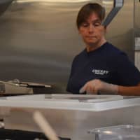 <p>Co-owner Stacy DiCostanzo is ready at the fry station at Cricket Car Hop.</p>
