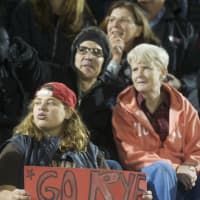 <p>Rye fans cheer for their team.</p>