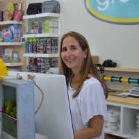<p>Corri Neckritz checks out customers in her new Groove location.</p>