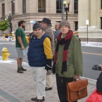 <p>Bundled-up extras mingled with crew members in shorts at McLevy Green Tuesday.</p>