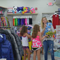 <p>Savvy shoppers comb the shelves at Groove of Westport.</p>