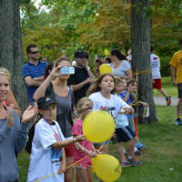 <p>Onlookers at the 5K road race in Armonk, which is named in honor of Jamie Love.</p>