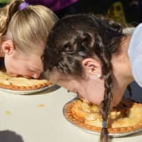 <p>Kids dig in for the pie-eating contest last Saturday at the 7th annual Country Fair at the Easton Public Library.</p>