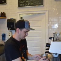 <p>A barista at Stamford&#x27;s Lorca makes a cappuccino.</p>