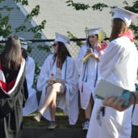 <p>Members of Fairfield Ludlowe High School&#x27;s class of 2016 sought shade and sports drinks at commencement Thursday.</p>