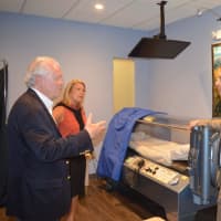 <p>Adam Breiner, ND, right, shows Fairfield First Selectman Michael Tetreau and state Rep. Brenda Kupchick the hyperbaric chamber at Breiner Whole-Body Health Center.</p>