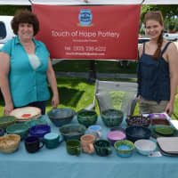 <p>Judy Harvey and friend Emily share the popularity of Touch of Hope pottery, which has won many prizes in craft fairs.</p>