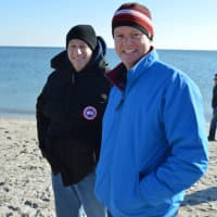 <p>Some in the crowd stay bundled up at the Polar Plunge.</p>