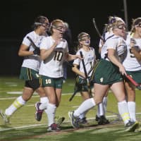 <p>The Hornets swarm Dana Bozek (center), after one of her four first-half goals in Lakeland&#x27;s win over Rye.</p>