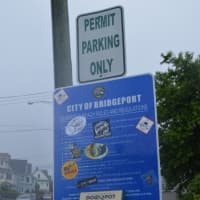 <p>Residents show their disdain for the new signs at Seabright Beach with stickers.</p>