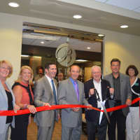 <p>Fairfield First Selectman Michael Tetreau does the honors at the official grand opening of Breiner Whole-Body Health Center.</p>